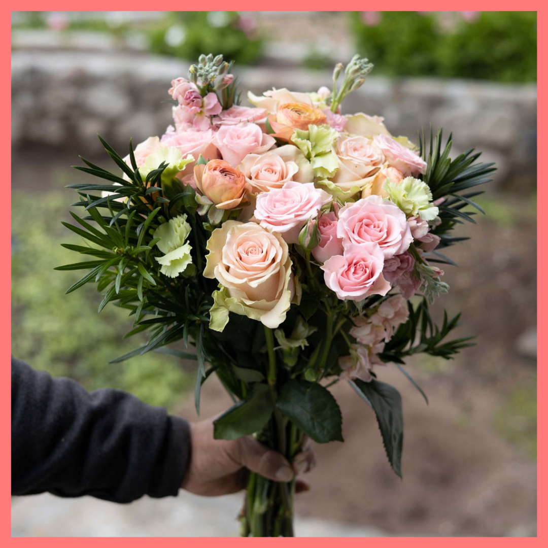 The Susie bouquet includes mixed stems of ranunculus, roses, spray roses, stock, solomio, and podocarpus. Please note that as flowers are a live product, colors and varieties may slightly vary from the photos shown to provide you with the freshest and most beautiful bouquet.