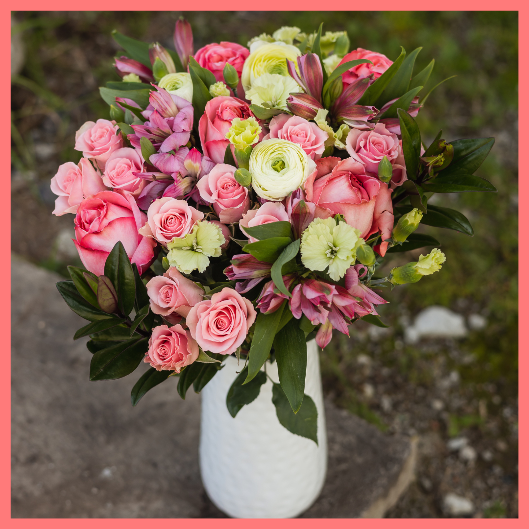 Order the Thinking of You flower bouquet! The Thinking of You bouquet includes mixed stems of roses, spray roses, solomio, alstroemeria, and ranunculus. The flowers will be shipped directly from the farm to you!